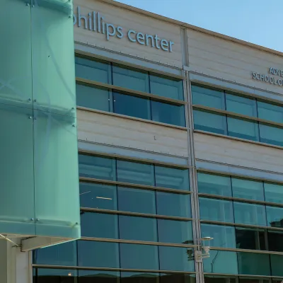 Facade of the Dr. Phillips Center for the Performing Arts with the AdventHealth School of Arts signage.