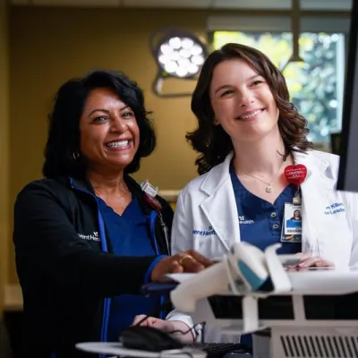 Nurse and doctor at a computer monitor