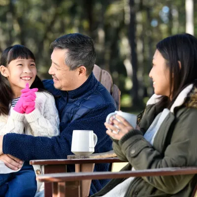 Family having coffee/tea outside