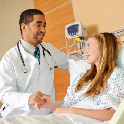 Physician with young female patient