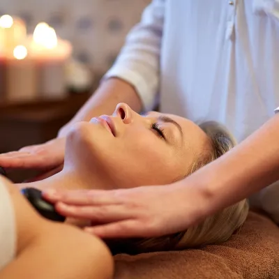 Patient receiving a hot stone massage