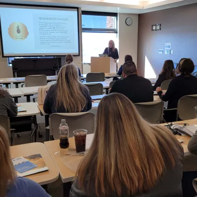 Nurses sit in a training session