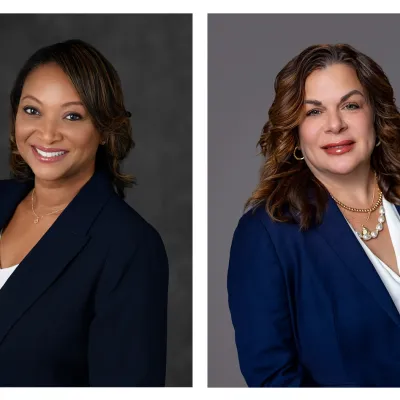 Two headshots of women: the left is of Paris Dukes, a woman wearing a black suit jacket and a white shirt. On the right is Patricia "Trish" Price, a woman with brown hair, wearing a blue suit jacket and a white shirt. 