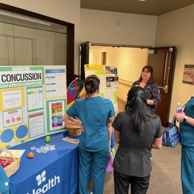 Team member educates others on concussion awareness