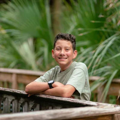 A boy on a boardwalk