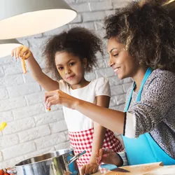 mother cooking with daughter