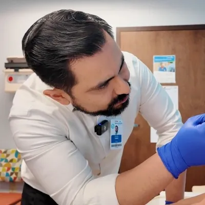 Dr. Joseph Lopez examines the mouth of a little girl named Madi, who had a cancerous tumor in her jaw.