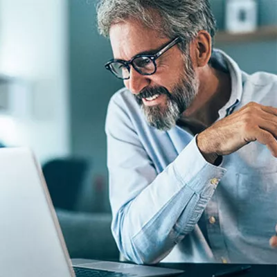 a-man-reading-a-tablet