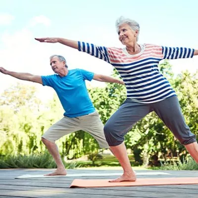 Senior Couple Doing Yoga Outside