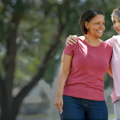 two women talking in park