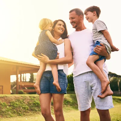Family in front of home