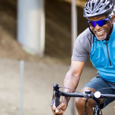 senior african american man riding a bike