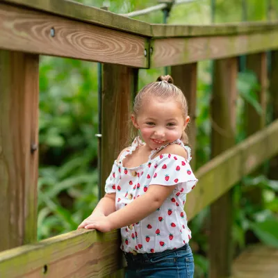 A young girl on a boardwalk