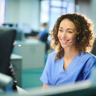 A nurse answering a phone call