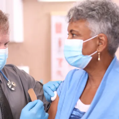 Older woman getting vaccinated