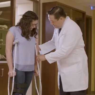 A Doctor Helps a Patient Adjust Her New Crutches