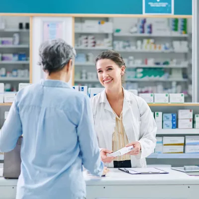 A pharmacist talking with a customer