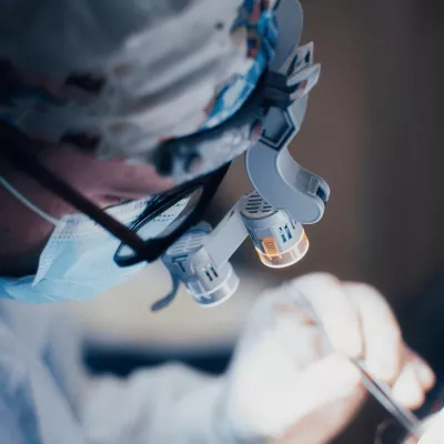 A surgeon performing reconstructive surgery.