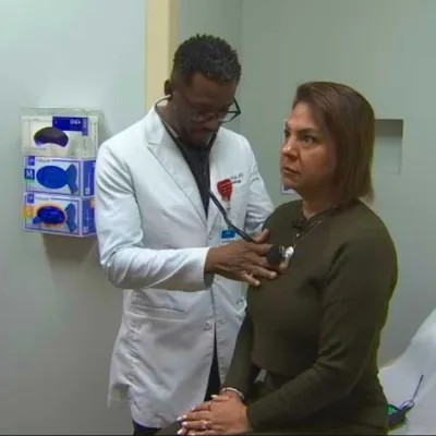 Dr. Linus Wodi seeing patient Reena Caprario at AH Apopka.