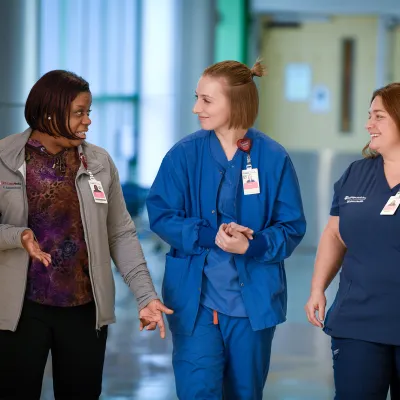 UCMAH Nurses Talking to Each Other in Hospital Hall