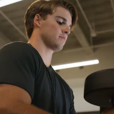 A young man lifting weights