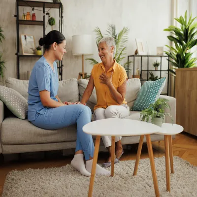 Older woman talking to caregiver