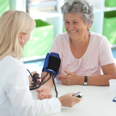 Woman getting blood pressure tested