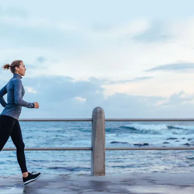 Woman running near the water