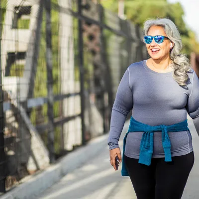 Smiling Woman Walking Outdoors