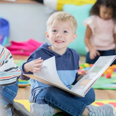 young boy reading