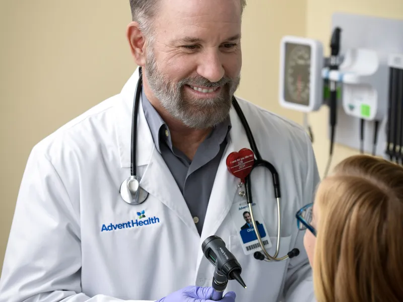 Doctor interacting with child patient