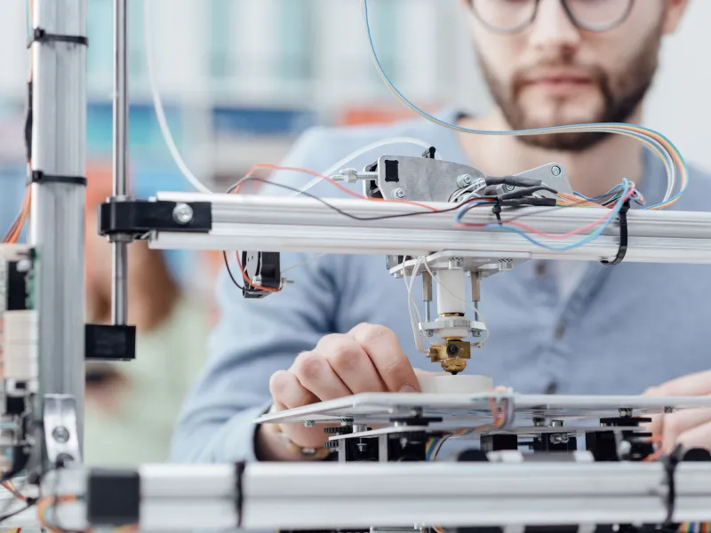 Man using 3D printer