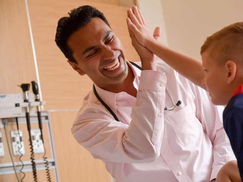 Dr. Sawh-Martinez with patient.