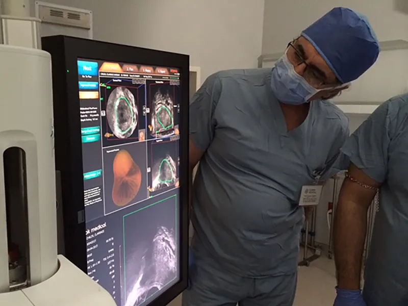 Global Robotics Doctors Looking at an MRI Fusion Machine
