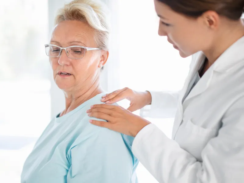 Woman Discussing Her Pain with Doctor