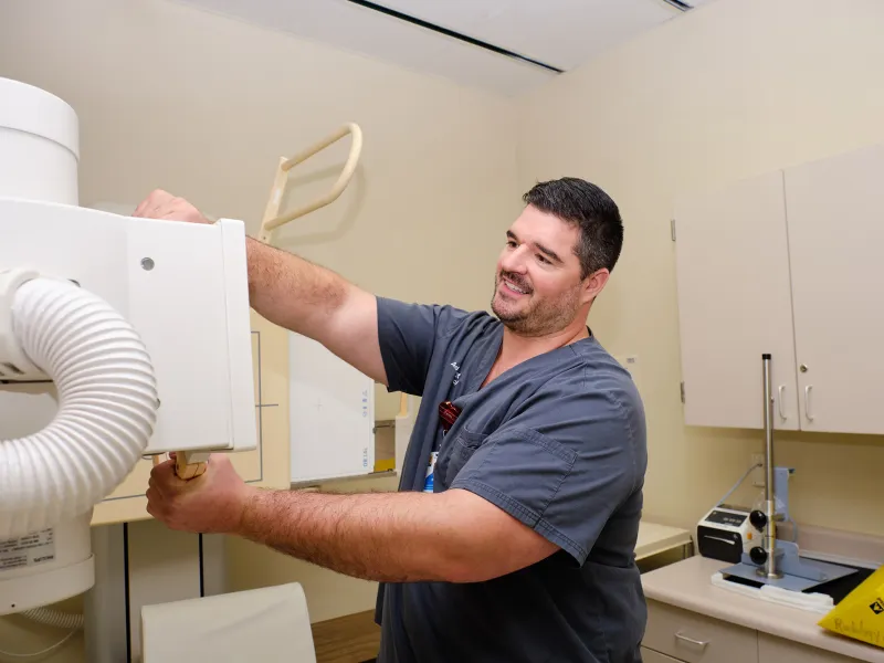 AdventHealth Dade City radiologist adjusting x-ray machine.