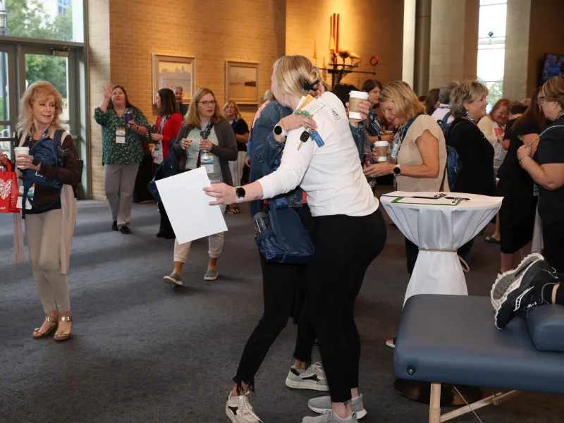 Women hugging at 2024 LIV conference