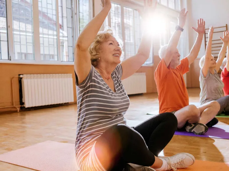A group of seniors doing a yoga session