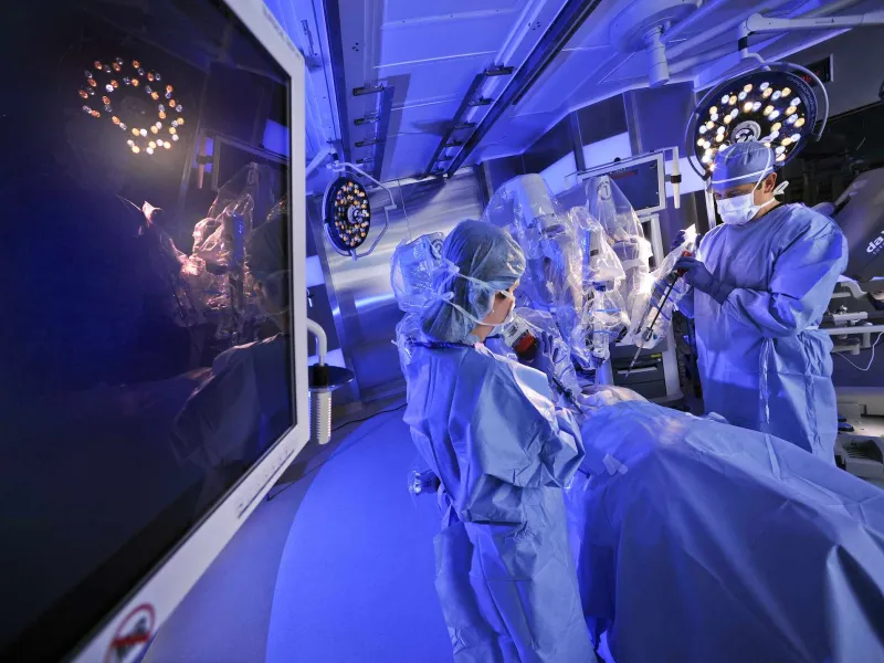 A physician and his staff are scrubbed-in in an operating room, preparing to perform a high-tech procedure at AdventHealth.