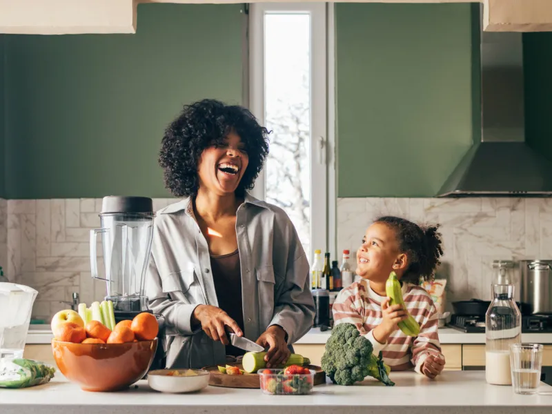 Woman cooking with her child