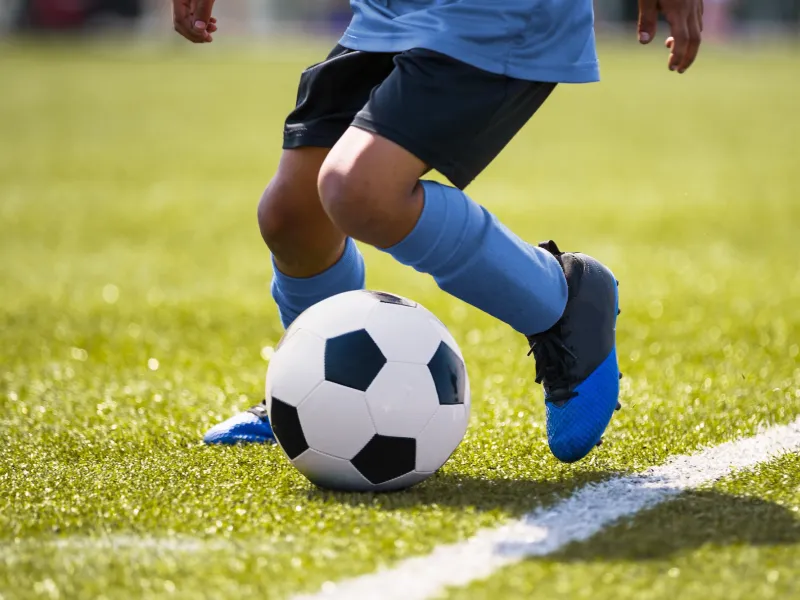 A young player at a soccer practice. 