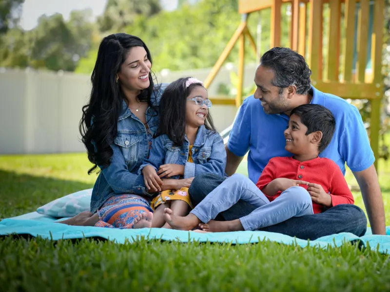 A Family Enjoys a Picnic in Their Backyard