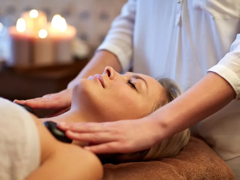 Patient receiving a hot stone massage