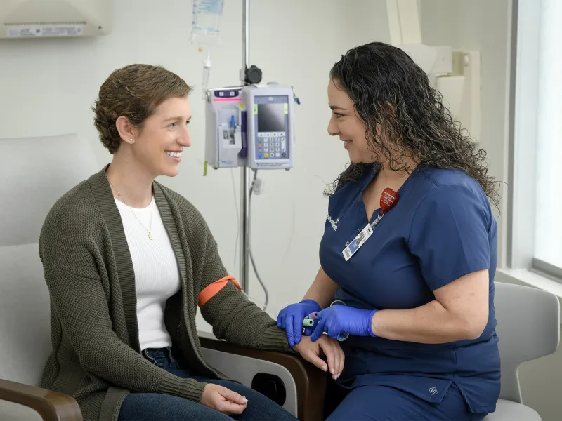 A female patient with an infusion specialist.