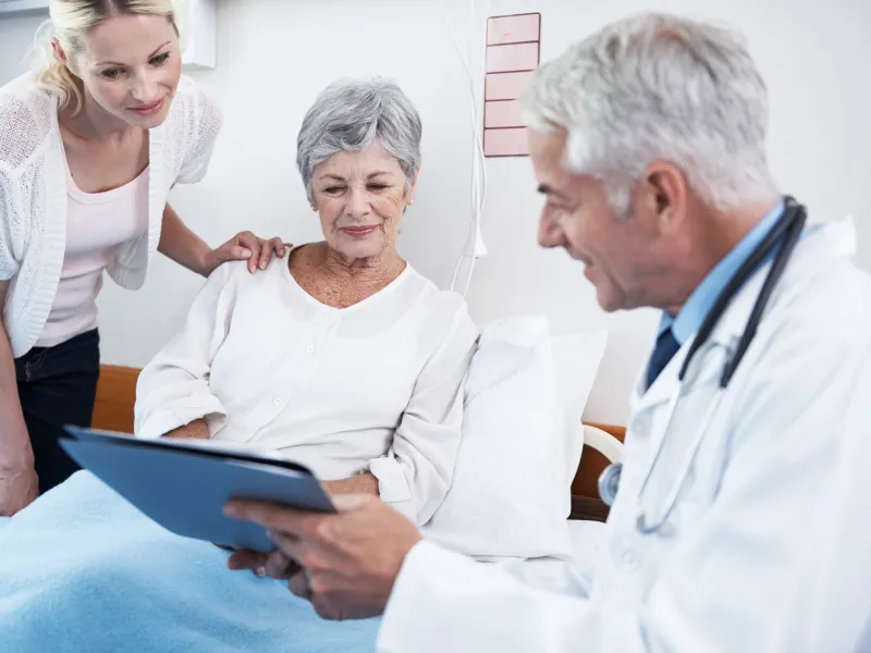 A doctor explains the procedure to a kidney transplant patient
