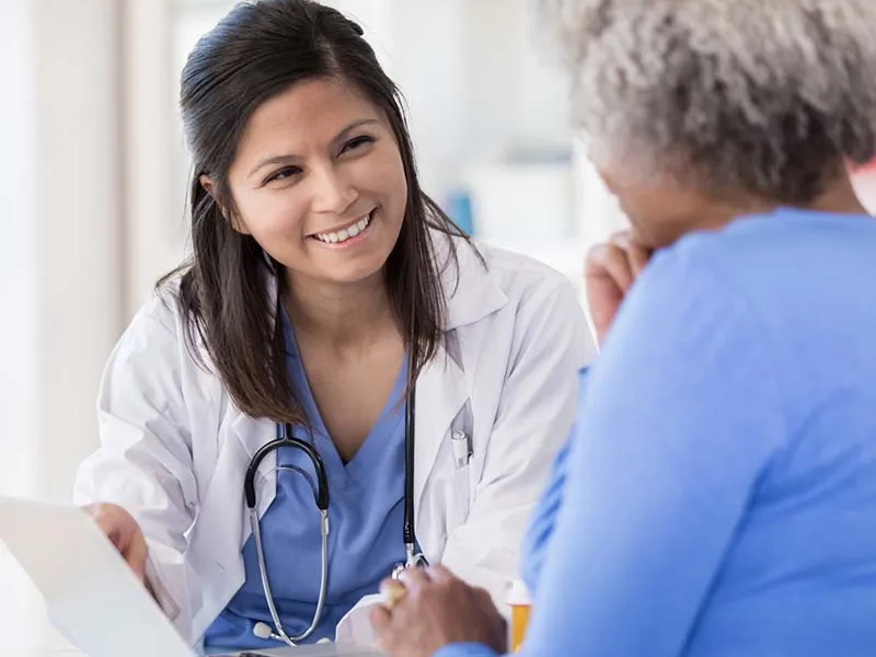 Female doctor talking to female patient