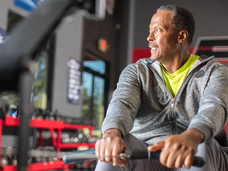 Man on a rowing machine.