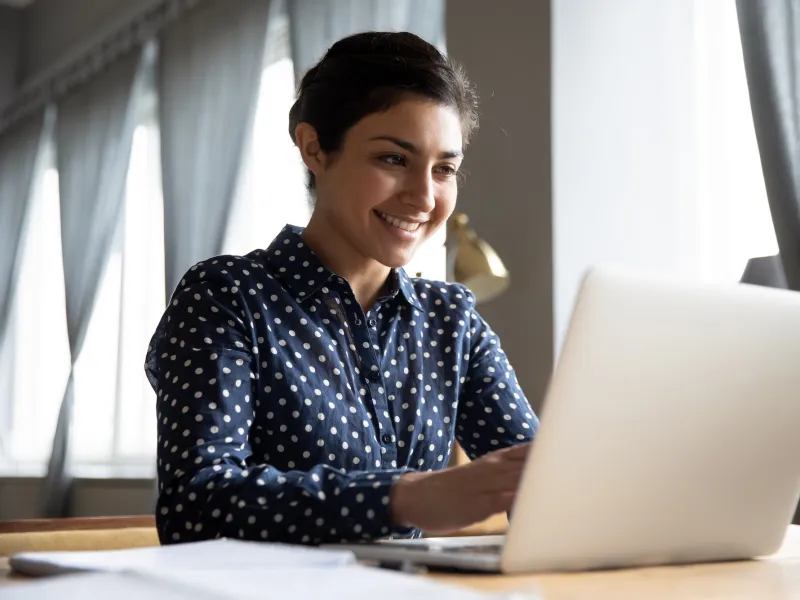 A woman using a laptop computer. 