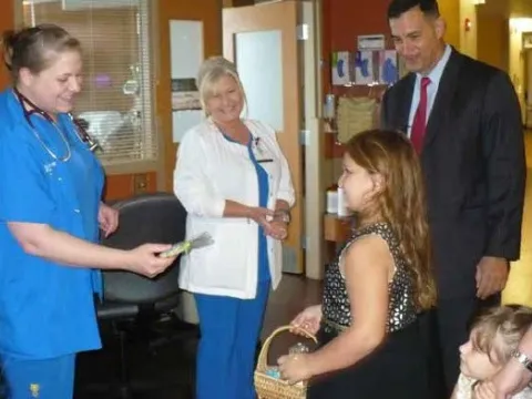 John and his nieces handing out cookies to the team that helped Timothy.