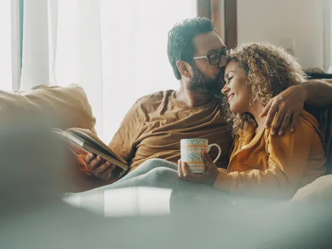 couple sitting on sofa together